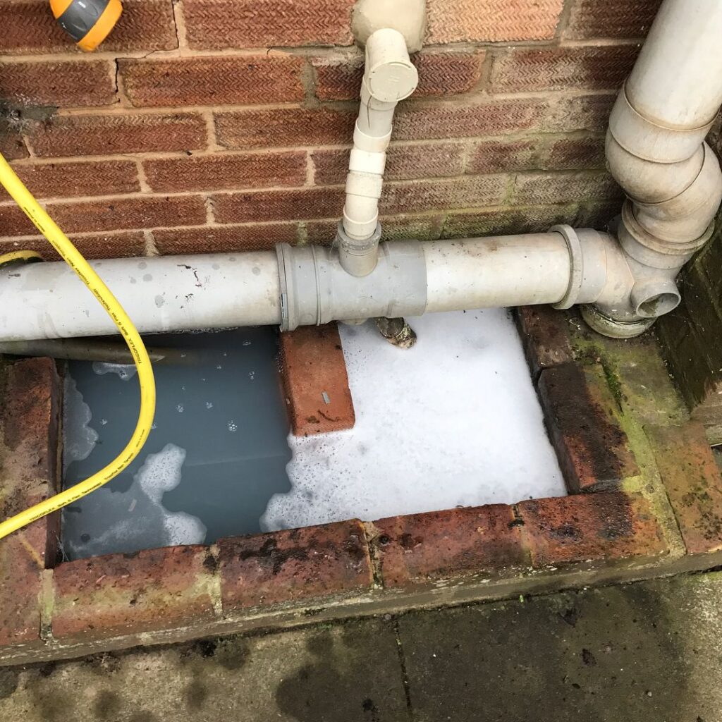 Pretoria plumber clearing a blocked outdoor drain